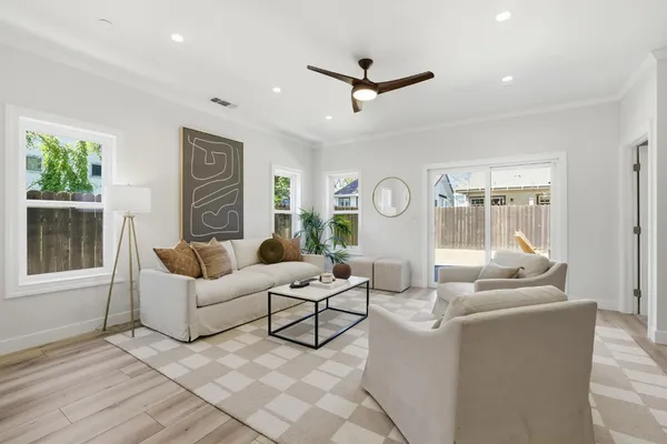 a living room with furniture and a large window