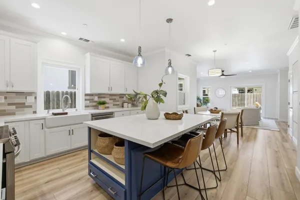 an open kitchen with a table and chairs in it
