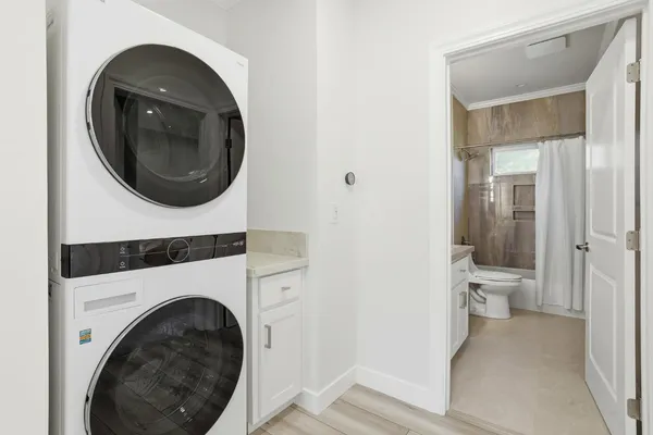 a view of a hallway with washer and dryer