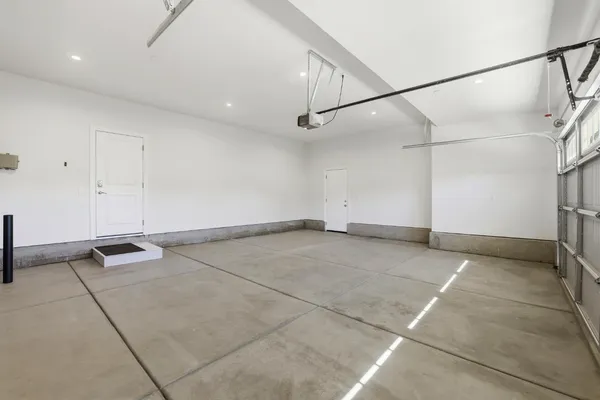 a view of a room with gym equipment and a living room view