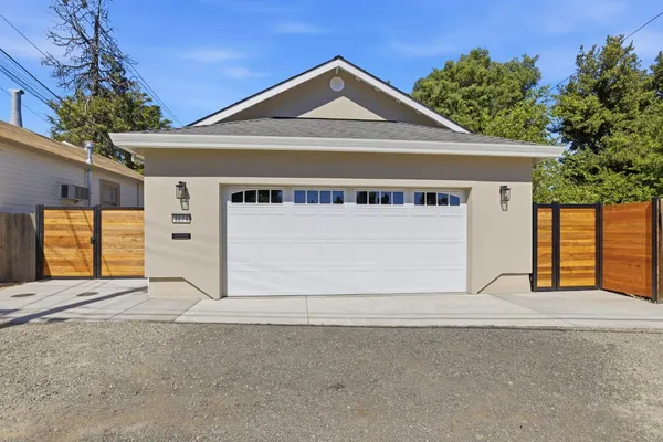 a front view of a house with a garage