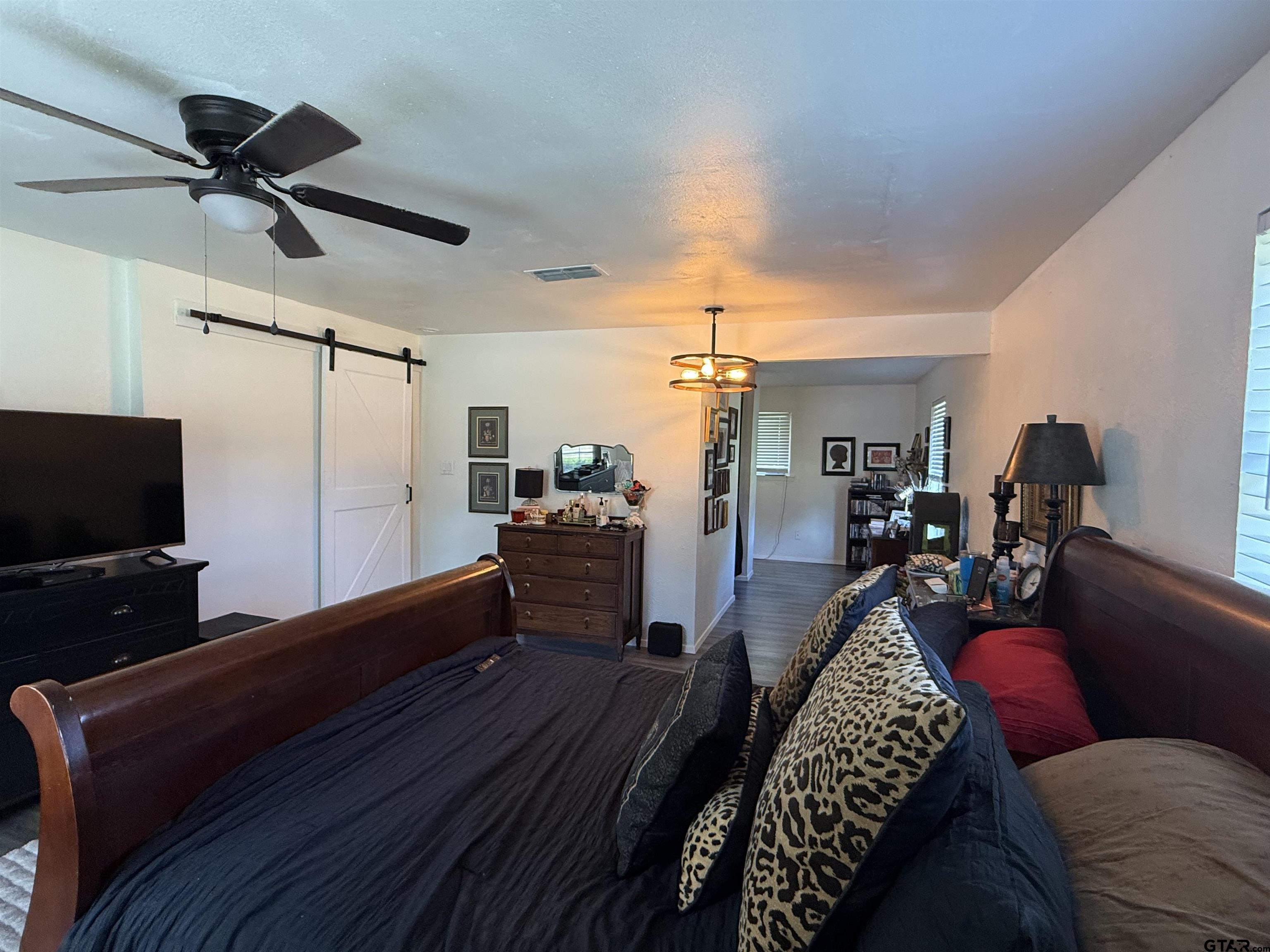 608 Pine Street Henderson, TX 75654 - Photo 16 of 46 a living room with furniture and a flat screen tv