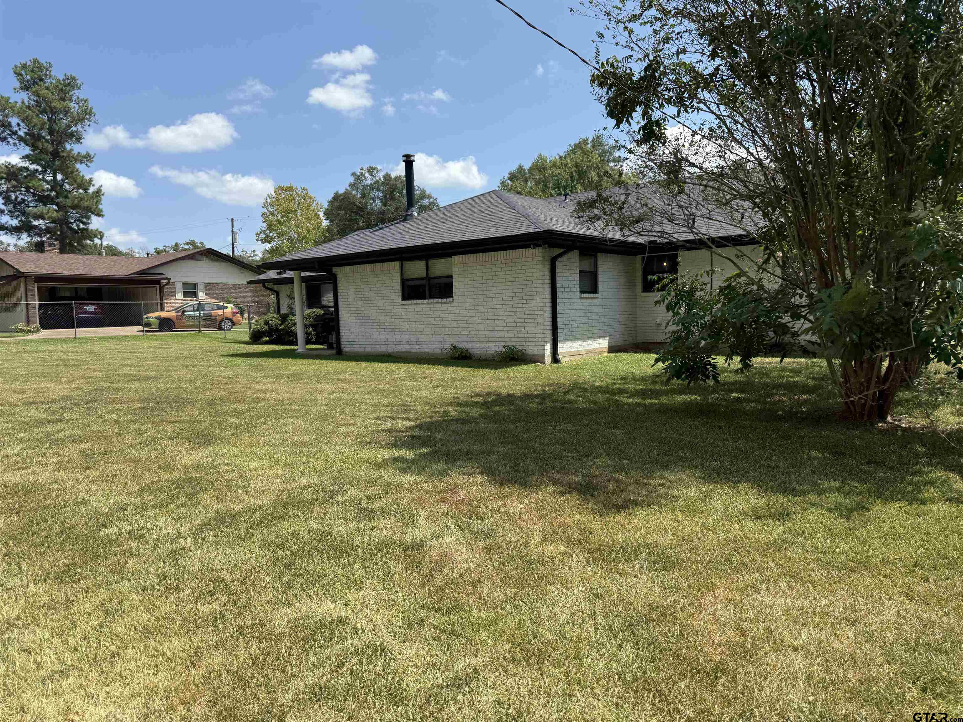 608 Pine Street Henderson, TX 75654 - Photo 21 of 46 a house view with a garden space