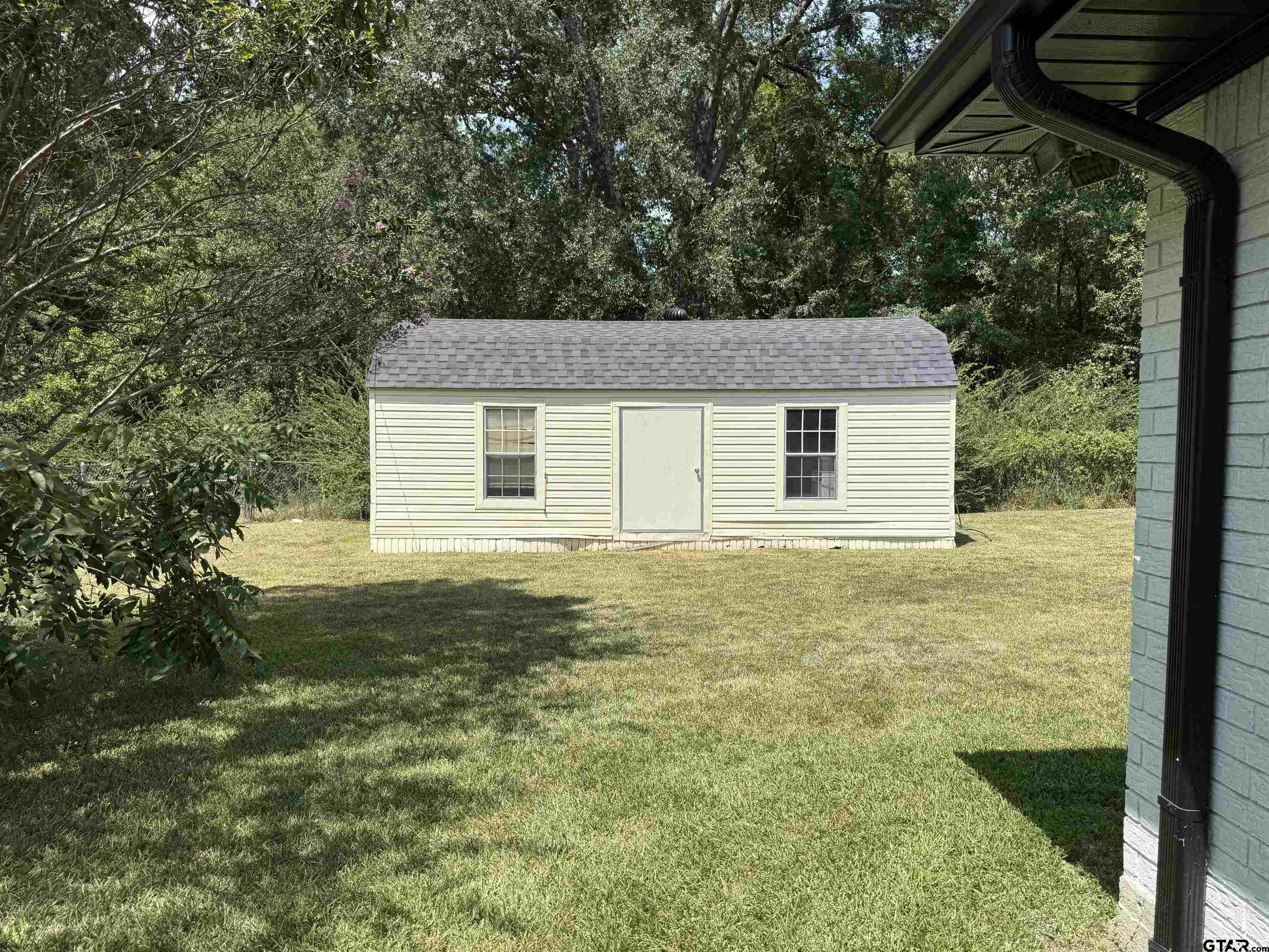 608 Pine Street Henderson, TX 75654 - Photo 25 of 46 a house with a yard