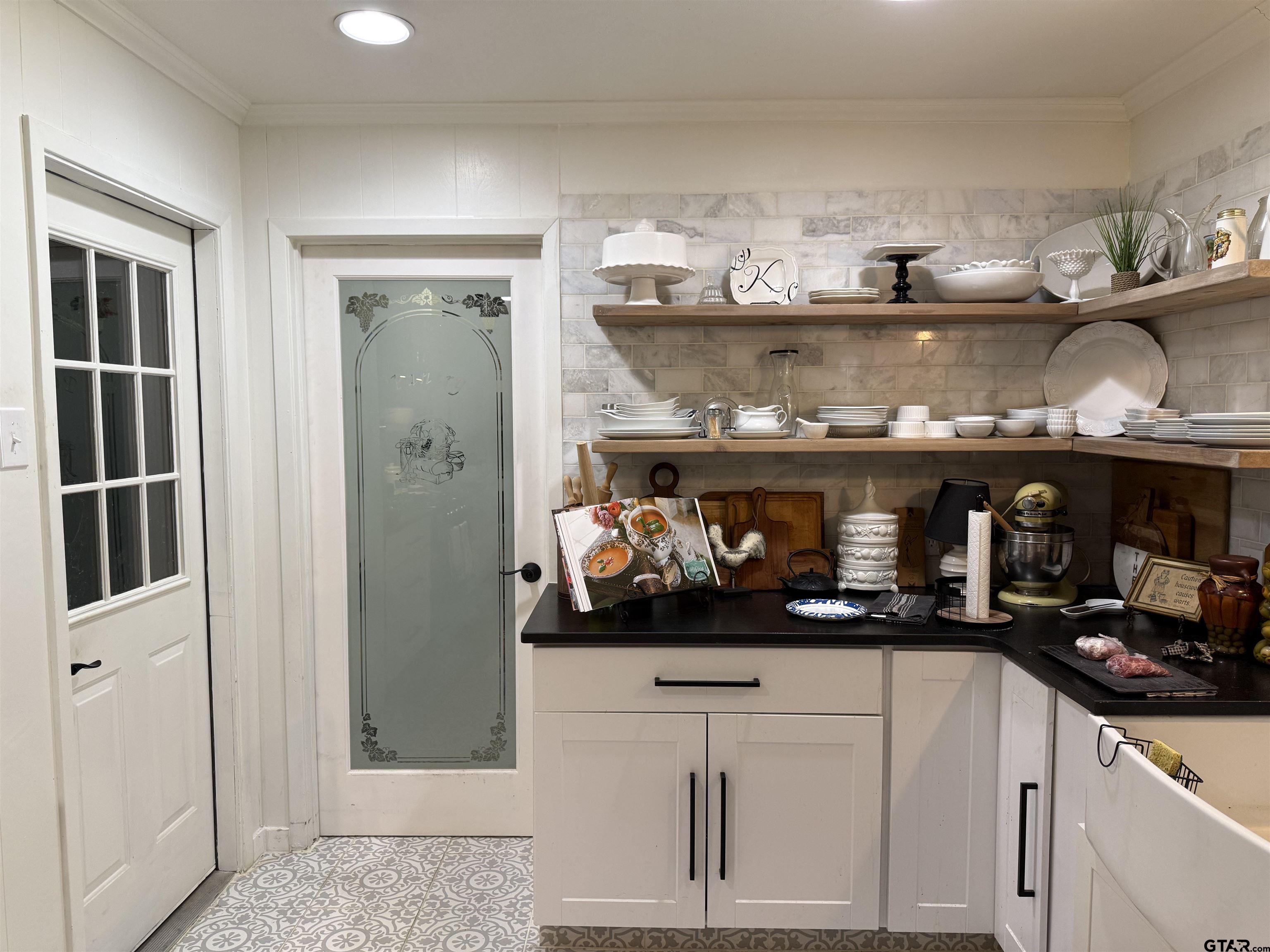 608 Pine Street Henderson, TX 75654 - Photo 33 of 46 a kitchen with a cabinets and a stove