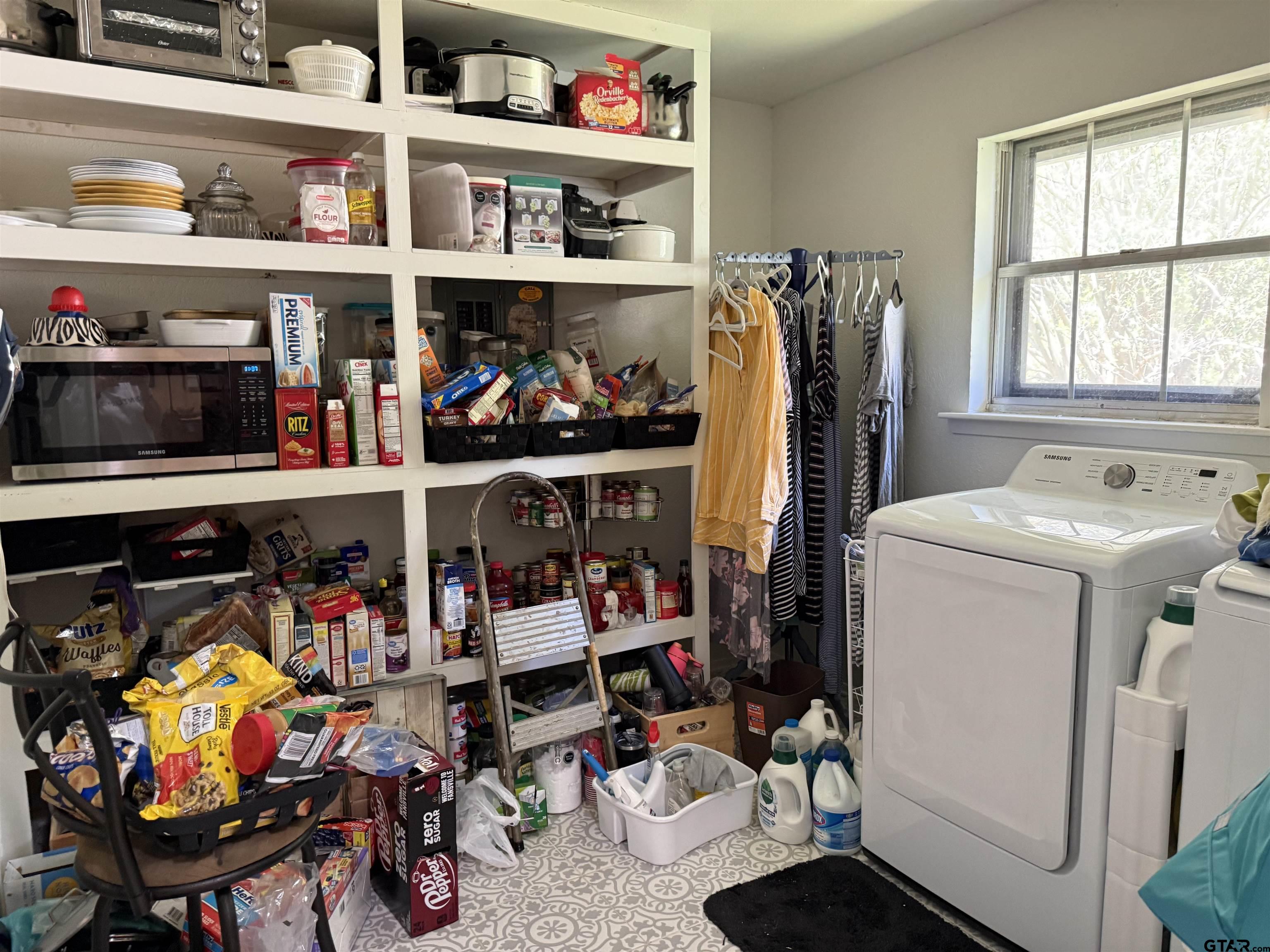608 Pine Street Henderson, TX 75654 - Photo 34 of 46 a storage room with washer and dryer