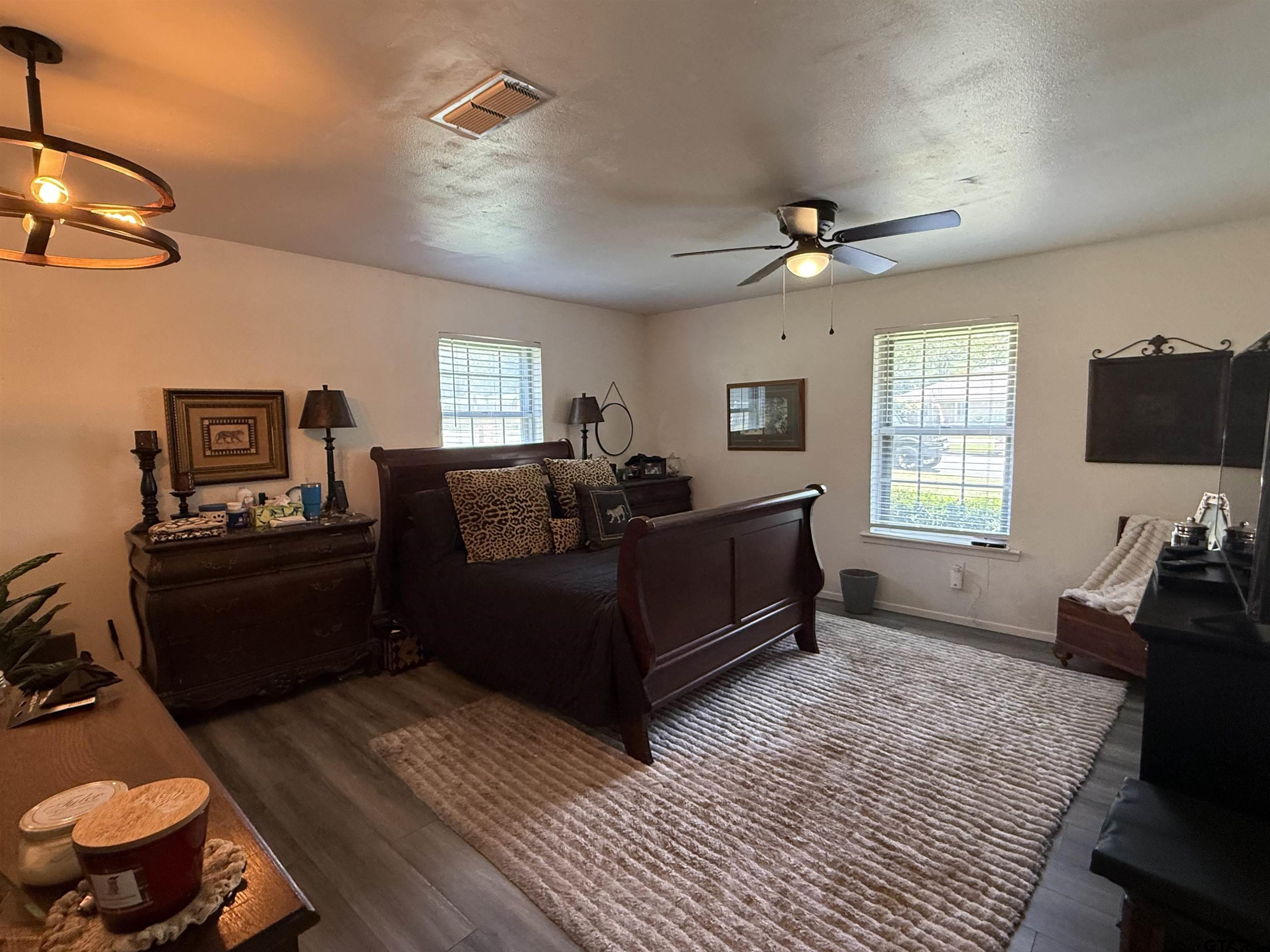 608 Pine Street Henderson, TX 75654 - Photo 39 of 46 a living room with furniture a flat screen tv and a window