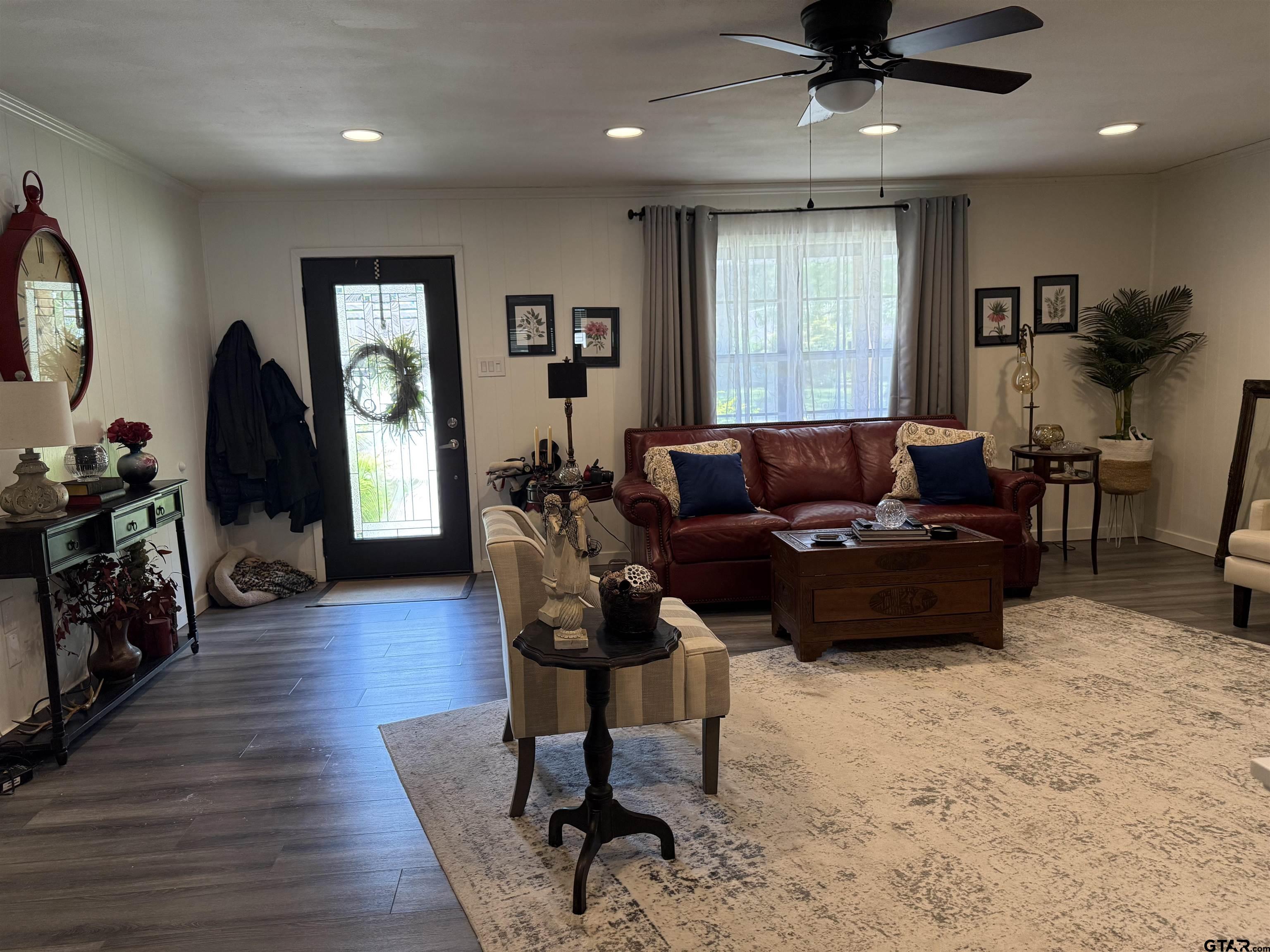 608 Pine Street Henderson, TX 75654 - Photo 5 of 46 a living room with furniture a wooden floor and a window
