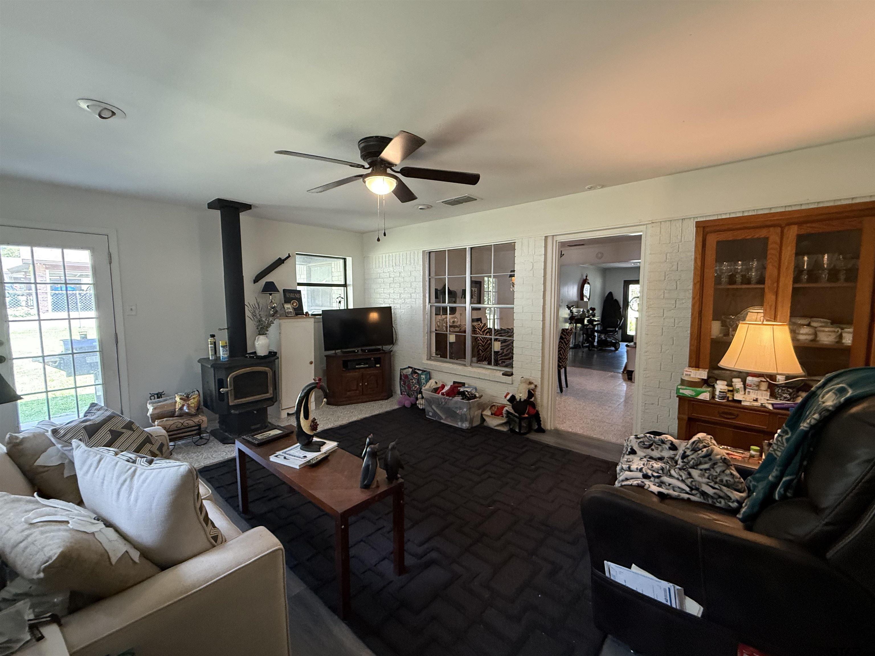608 Pine Street Henderson, TX 75654 - Photo 9 of 46 a living room with furniture and a flat screen tv