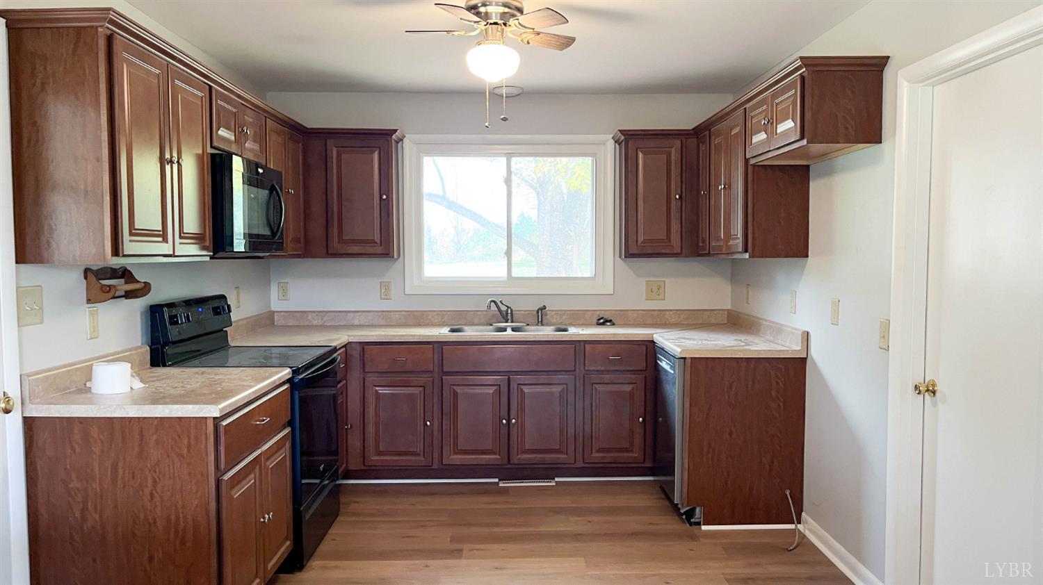 751 Long Island Road Gladys, VA 24554 - Photo 14 of 63 a kitchen with a sink stove and microwave