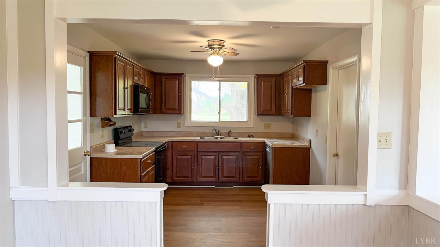 751 Long Island Road Gladys, VA 24554 - Photo 15 of 63 a kitchen with stainless steel appliances granite countertop a sink stove and refrigerator