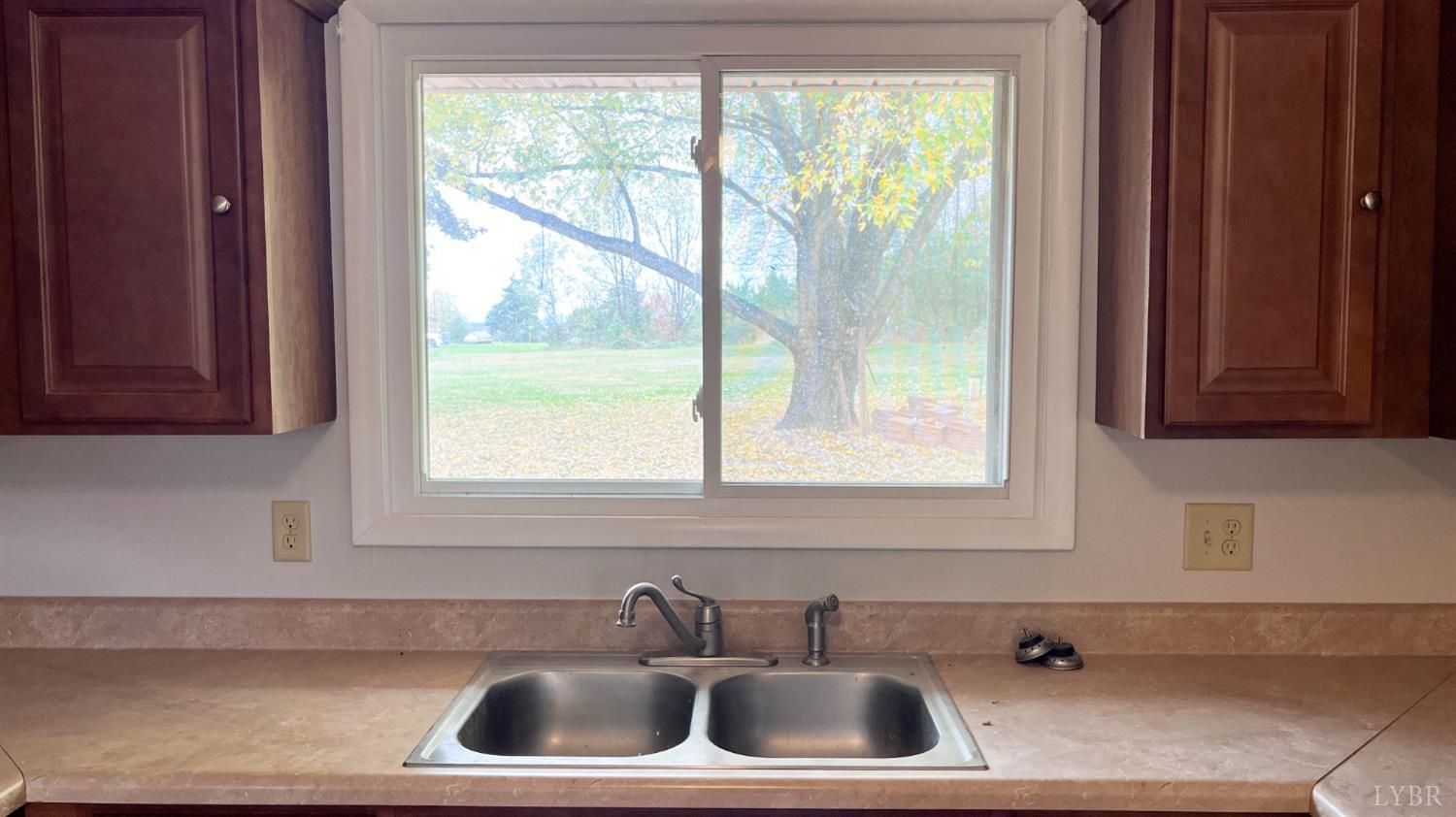 751 Long Island Road Gladys, VA 24554 - Photo 18 of 63 a bathroom with a sink and a window