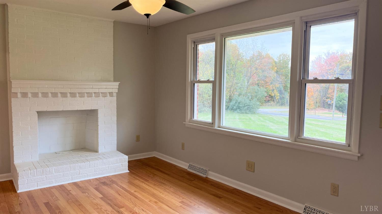 751 Long Island Road Gladys, VA 24554 - Photo 26 of 63 a view of empty room with wooden floor and fan