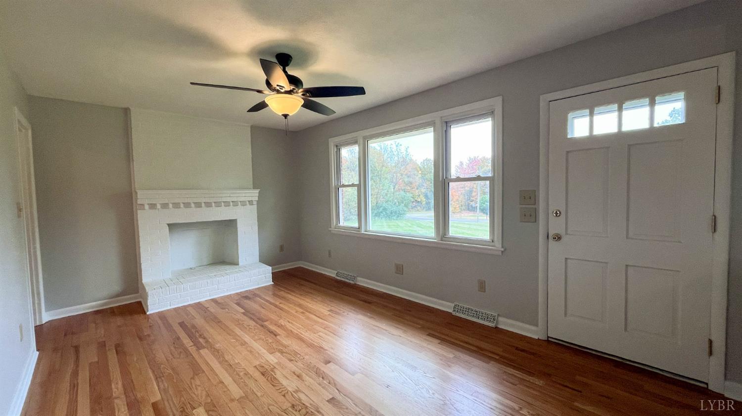 751 Long Island Road Gladys, VA 24554 - Photo 27 of 63 a view of empty room with wooden floor and fan