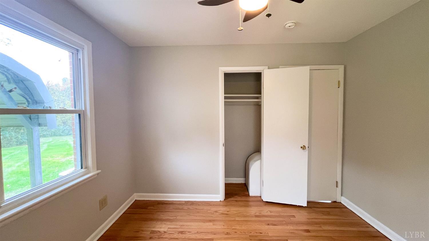 751 Long Island Road Gladys, VA 24554 - Photo 36 of 63 a view of empty room with wooden floor and fan