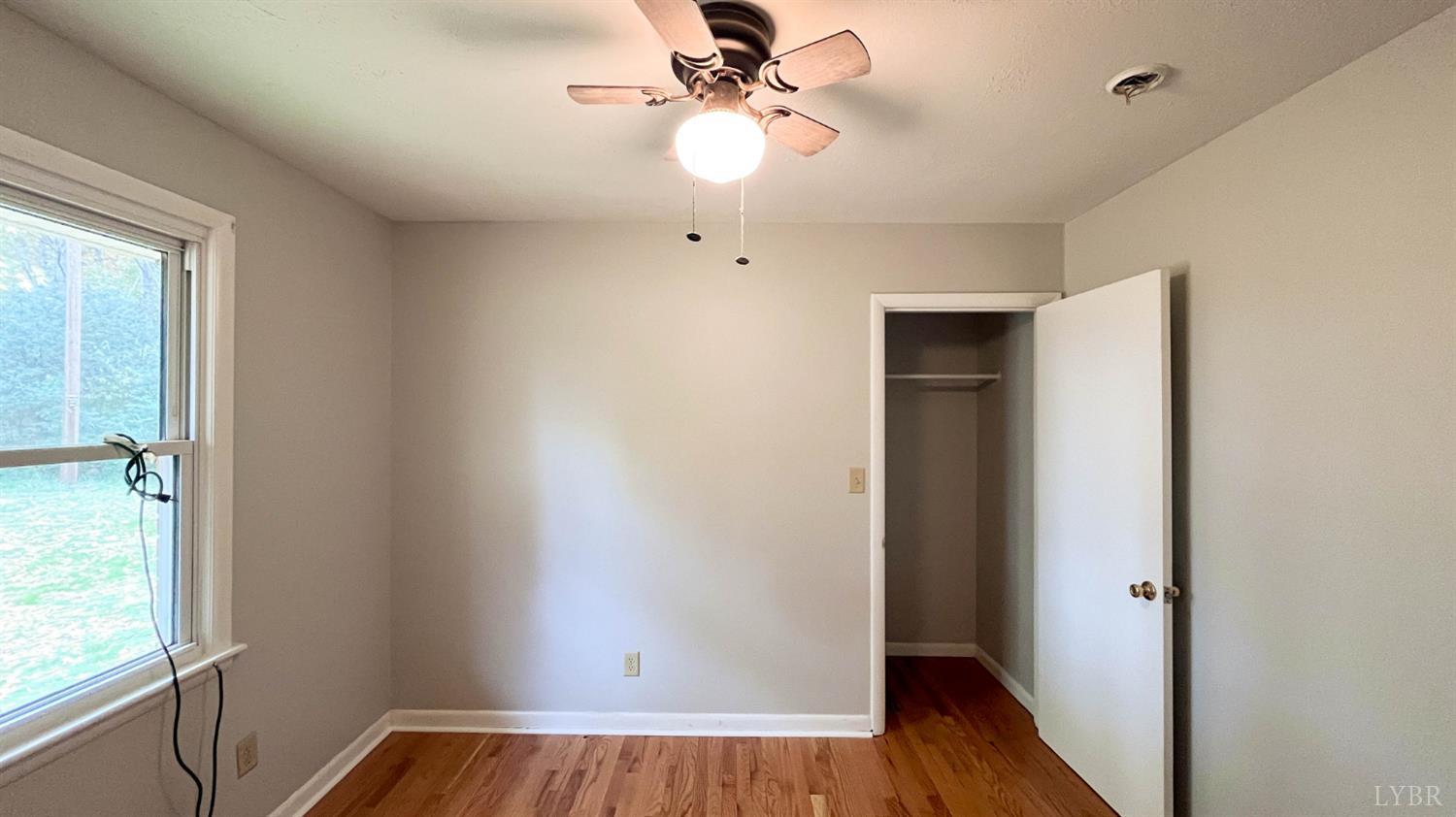 751 Long Island Road Gladys, VA 24554 - Photo 45 of 63 a view of room with window ceiling fan and hardwood floor