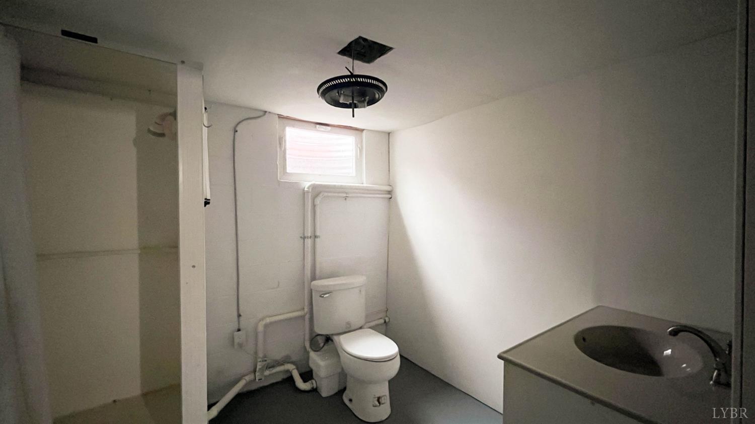 751 Long Island Road Gladys, VA 24554 - Photo 48 of 63 a bathroom with a toilet and a sink