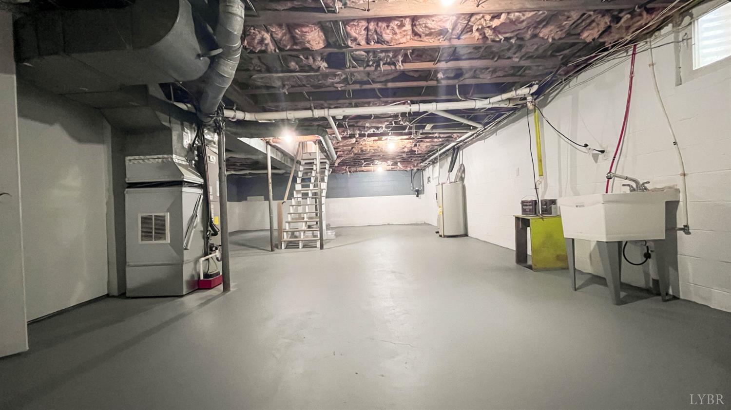 751 Long Island Road Gladys, VA 24554 - Photo 49 of 63 a view of water heater room with staircase