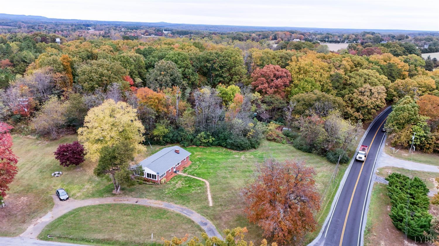 751 Long Island Road Gladys, VA 24554 - Photo 54 of 63 an aerial view of a house with a yard and large tree