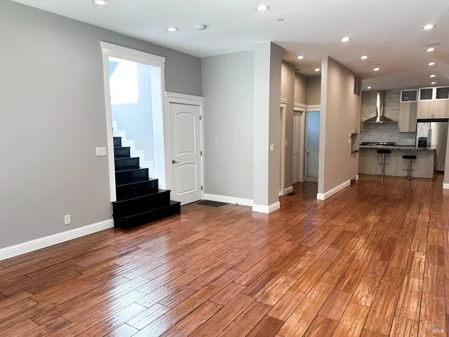 a view of kitchen with cabinets and wooden floor