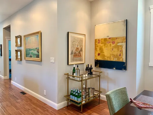 a room with furniture and painting on the wall