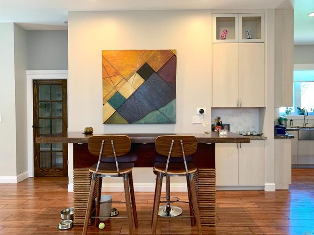 a kitchen with a table chairs and a sink