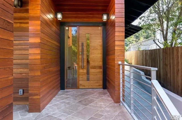 a view of a door and wooden floor