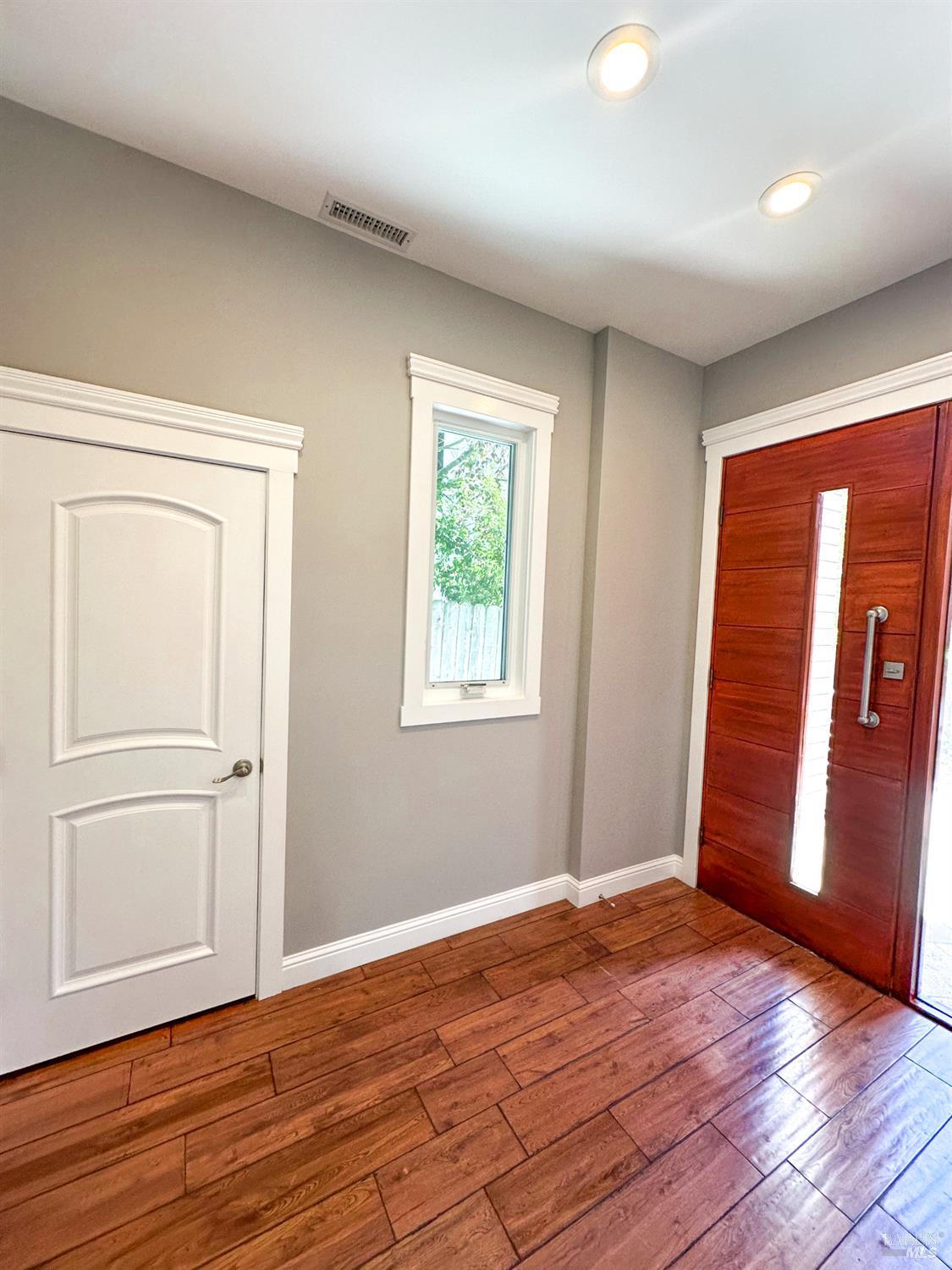 40 Villa Avenue San Rafael, CA 94901 - Photo 6 of 48 an empty room with wooden floor and windows