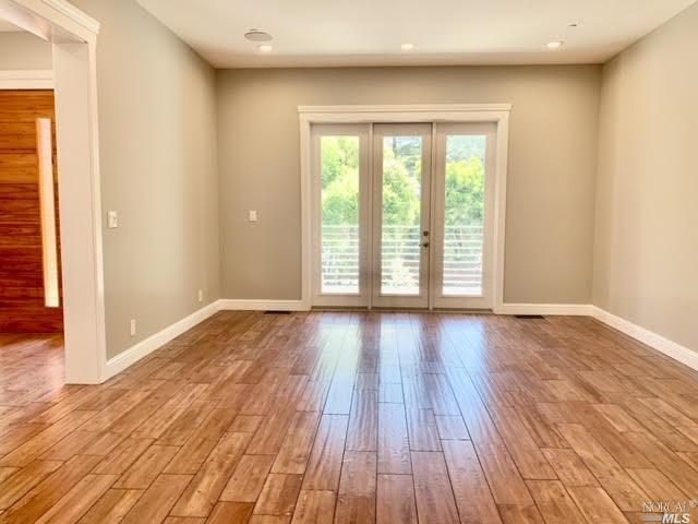 40 Villa Avenue San Rafael, CA 94901 - Photo 7 of 48 a view of an empty room with wooden floor and a window