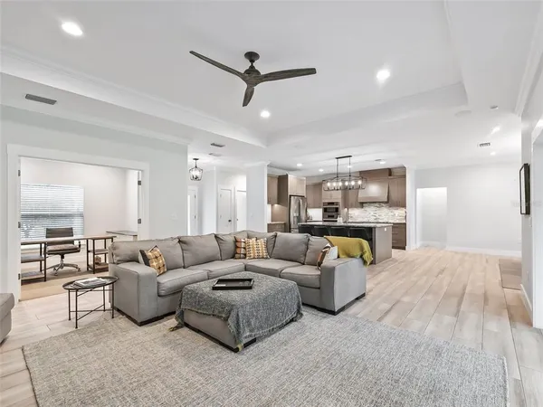 a living room with furniture fireplace and flat screen tv