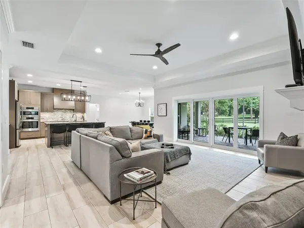 a bedroom with a large bed and a flat screen tv