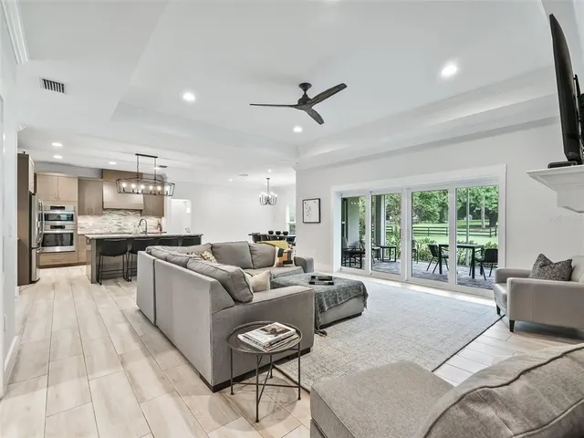 a bedroom with a large bed and a flat screen tv
