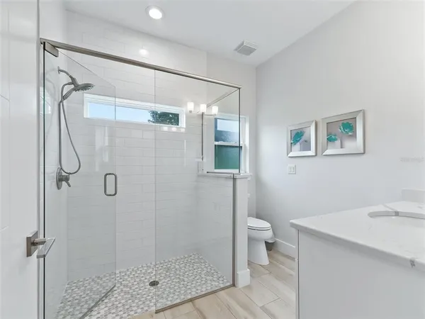 a bathroom with a sink vanity and a mirror