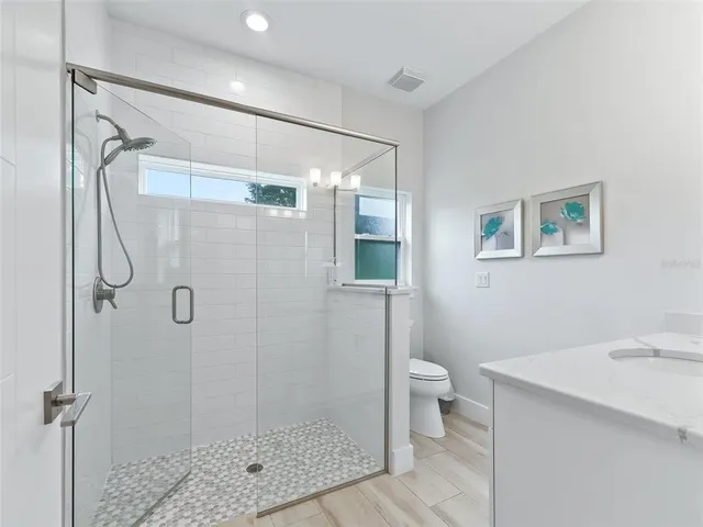 a bathroom with a sink vanity and a mirror