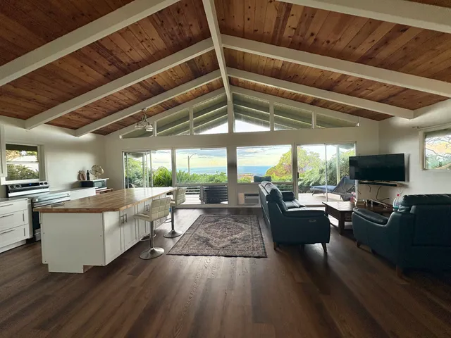 a living room with fireplace furniture and a flat screen tv