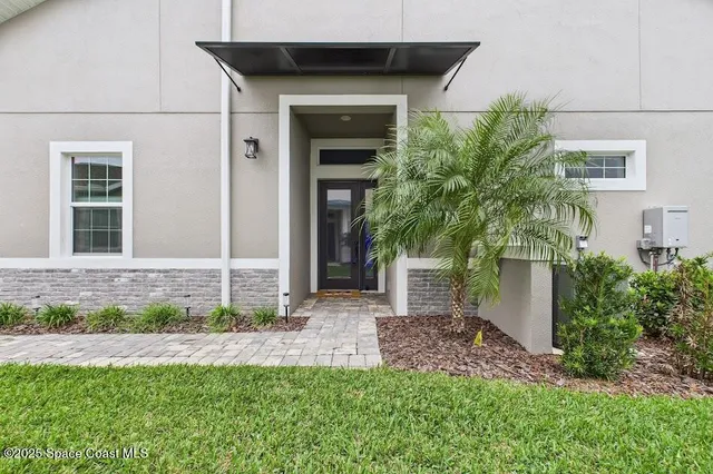 an aerial view of a pool patio fire pit and outdoor kitchen