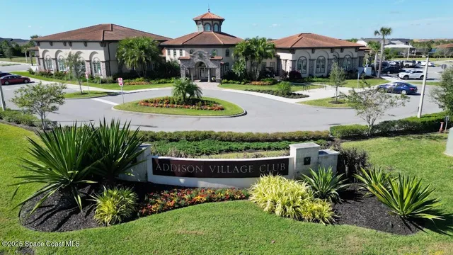 an aerial view of a city with swimming pool and outdoor seating