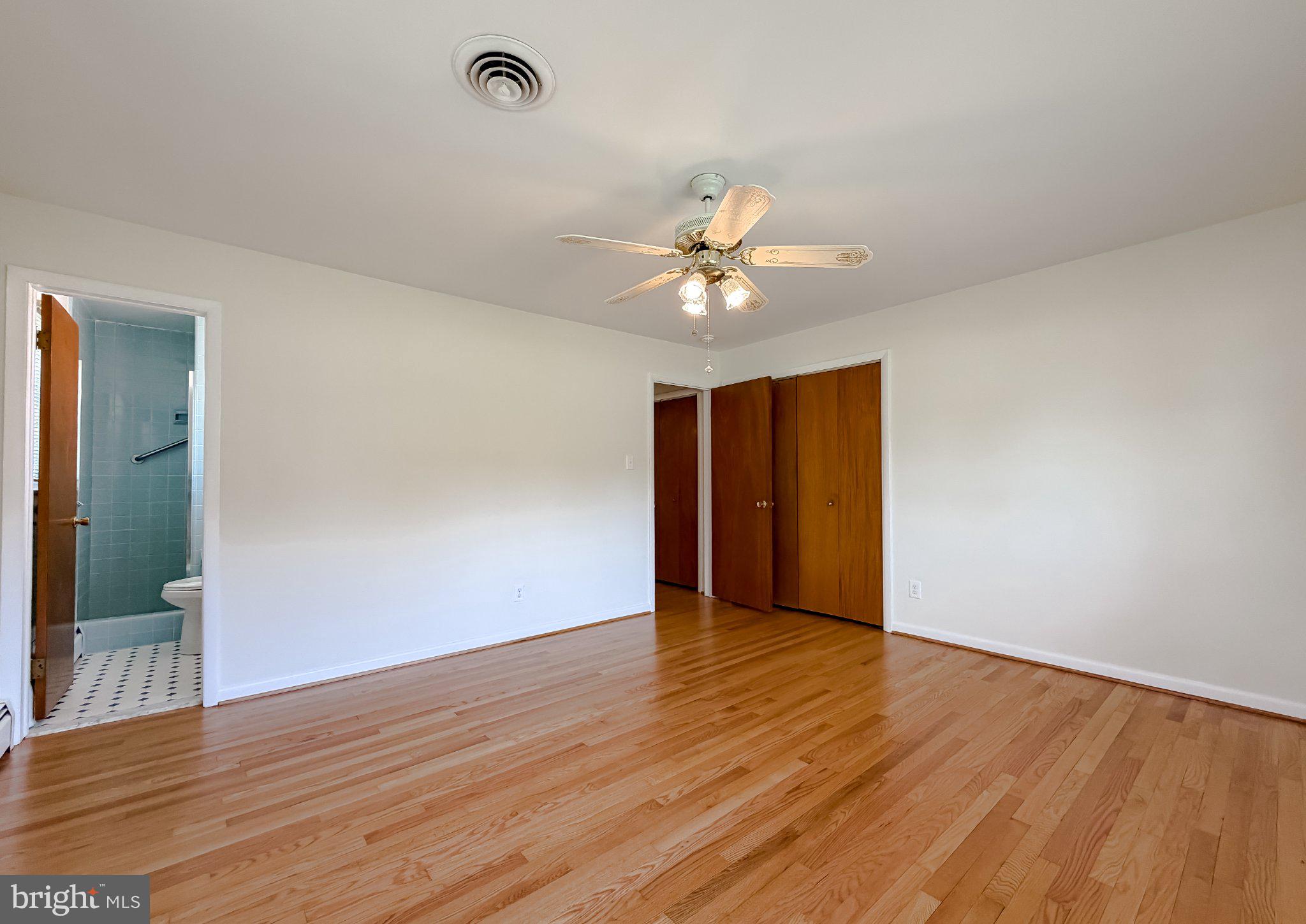 23230 Colton Point Road Avenue, MD 20609 - Photo 35 of 63 Spacious room with warm wood floors.
