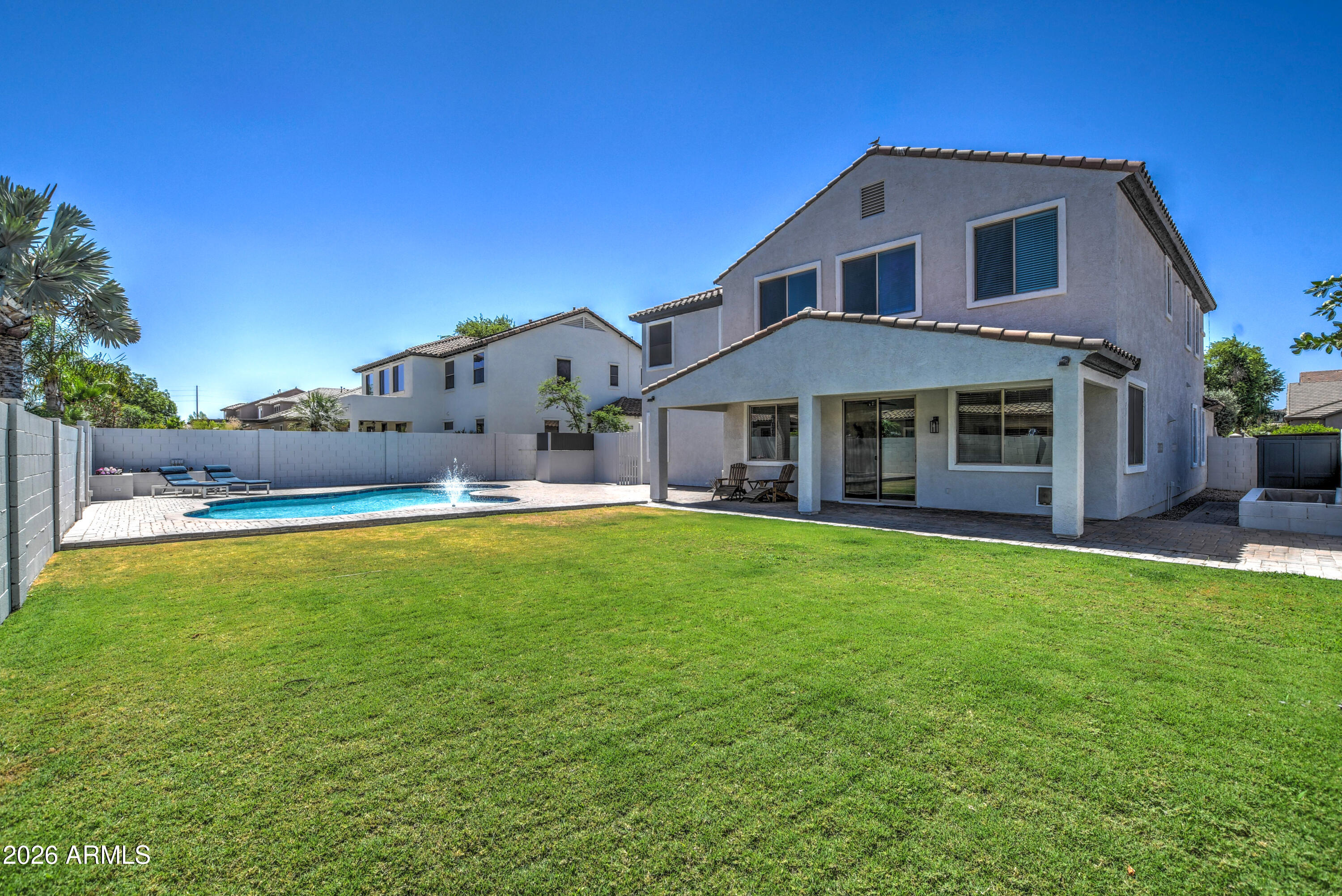 3078 East Muirfield Street Gilbert, AZ 85298 - Photo 79 of 92 a front view of a house with a yard