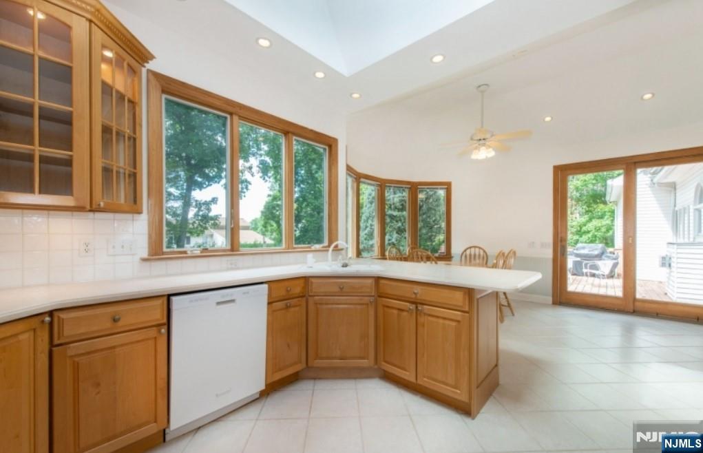 9 Forest Terrace Wayne, NJ 07470 - Photo 11 of 23 a kitchen with a sink stove and cabinets