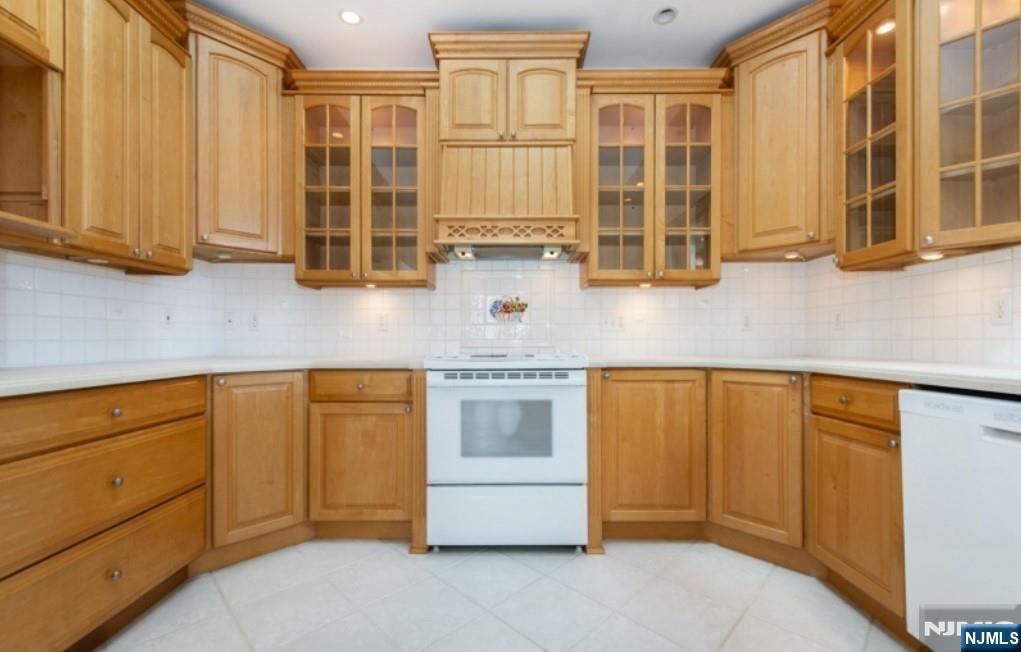 9 Forest Terrace Wayne, NJ 07470 - Photo 12 of 23 a kitchen with stainless steel appliances granite countertop a stove and cabinets