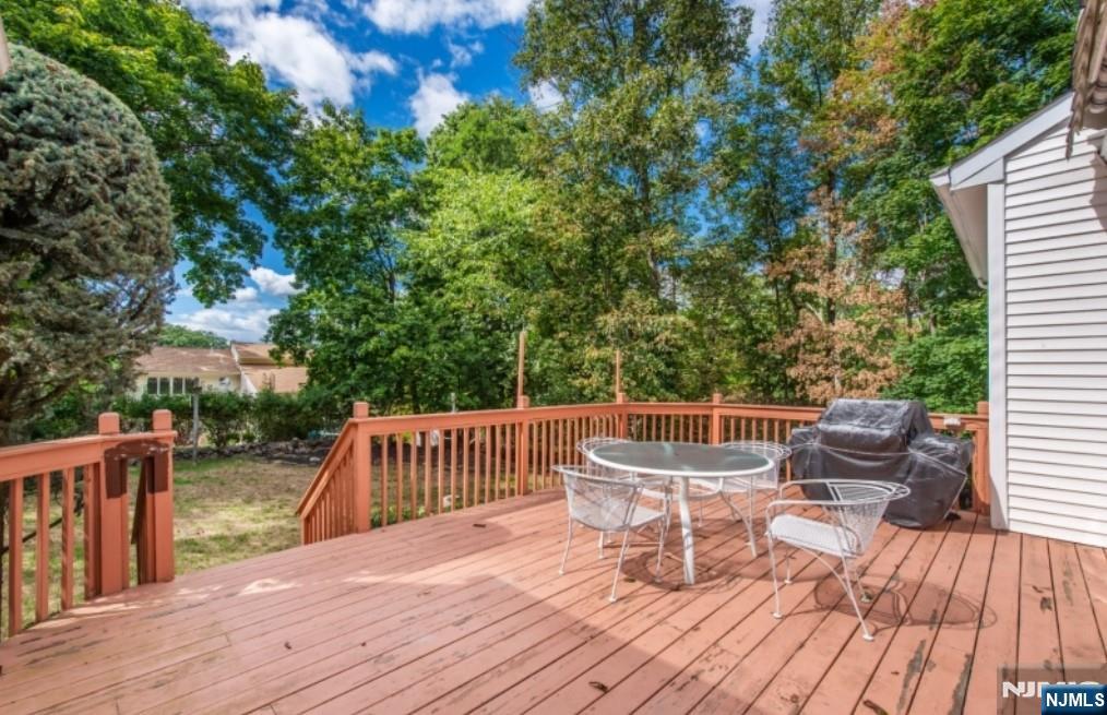 9 Forest Terrace Wayne, NJ 07470 - Photo 14 of 23 a view of a chairs and table on the wooden floor