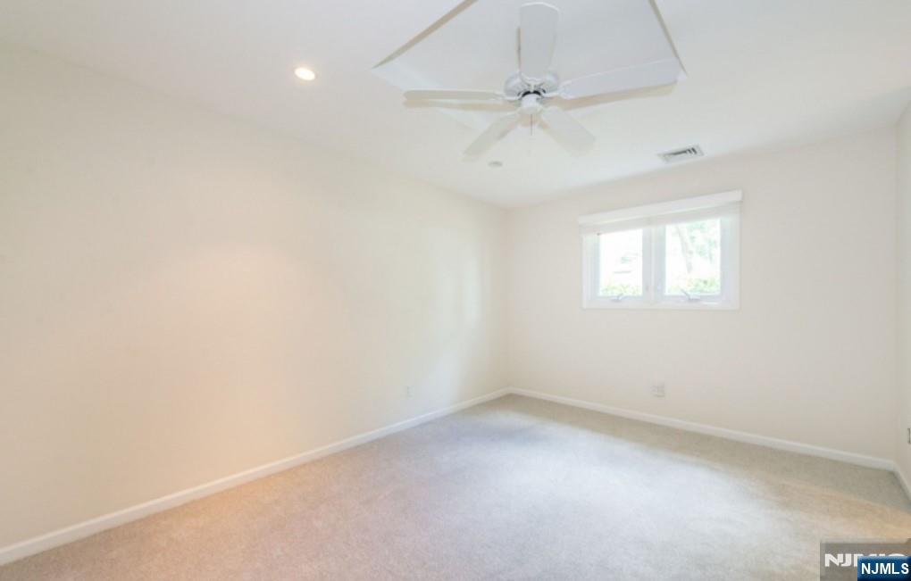 9 Forest Terrace Wayne, NJ 07470 - Photo 16 of 23 an empty room with a window and a fan