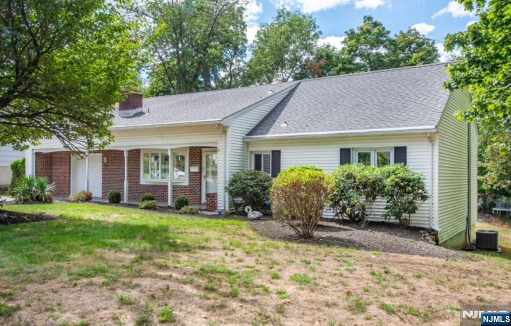 9 Forest Terrace Wayne, NJ 07470 - Photo 2 of 23 a view of a house with a yard and plants