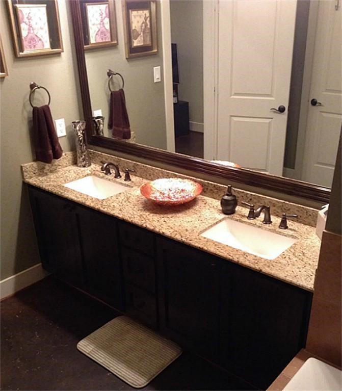 2423 Roufa Road Houston, TX 77003 - Photo 9 of 22 The downstairs primary bathroom has two (2) sink vanities.