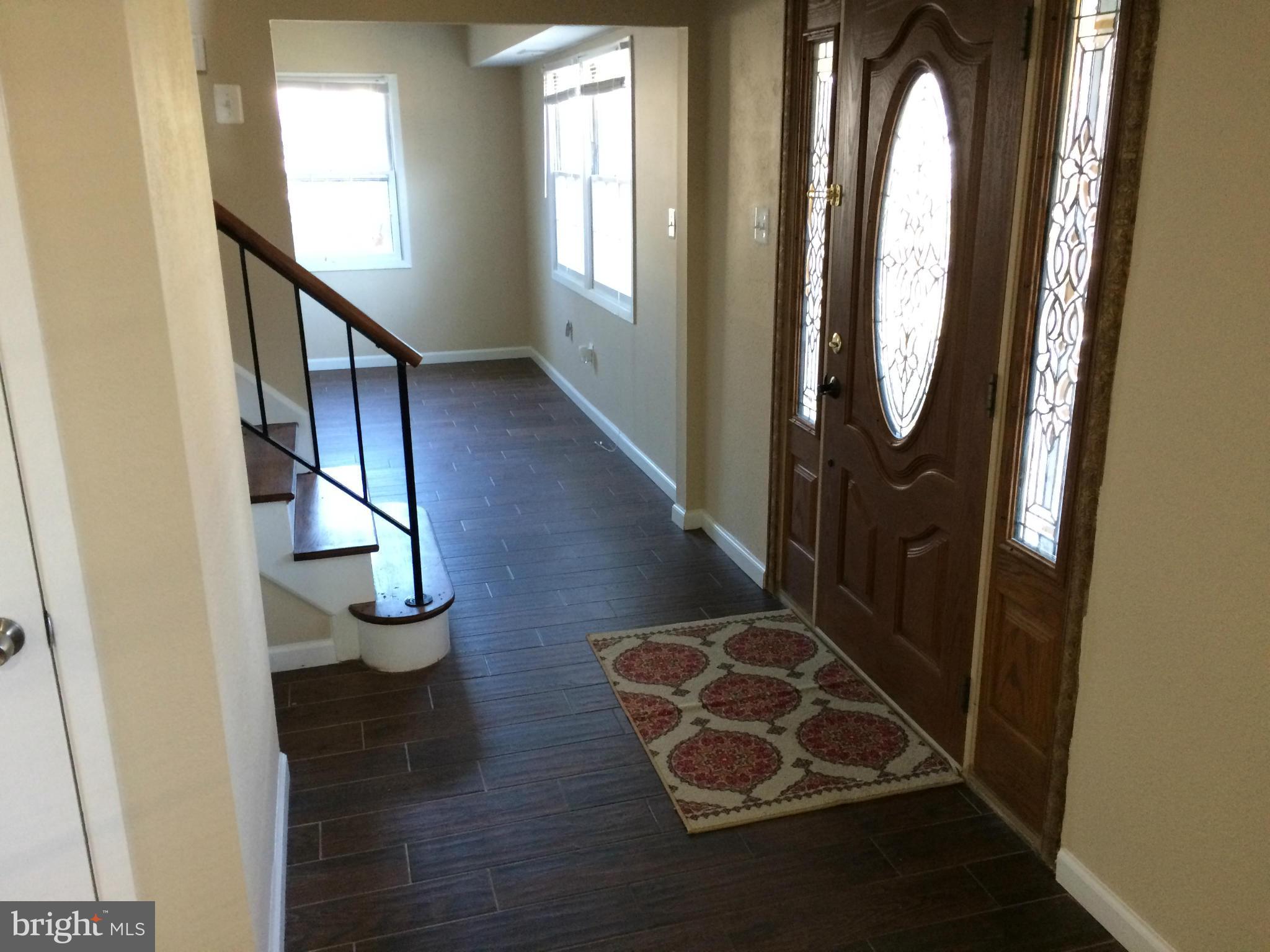 12612 Cedarbrook Lane Laurel, MD 20708 - Photo 16 of 22 a view of entryway with wooden floor