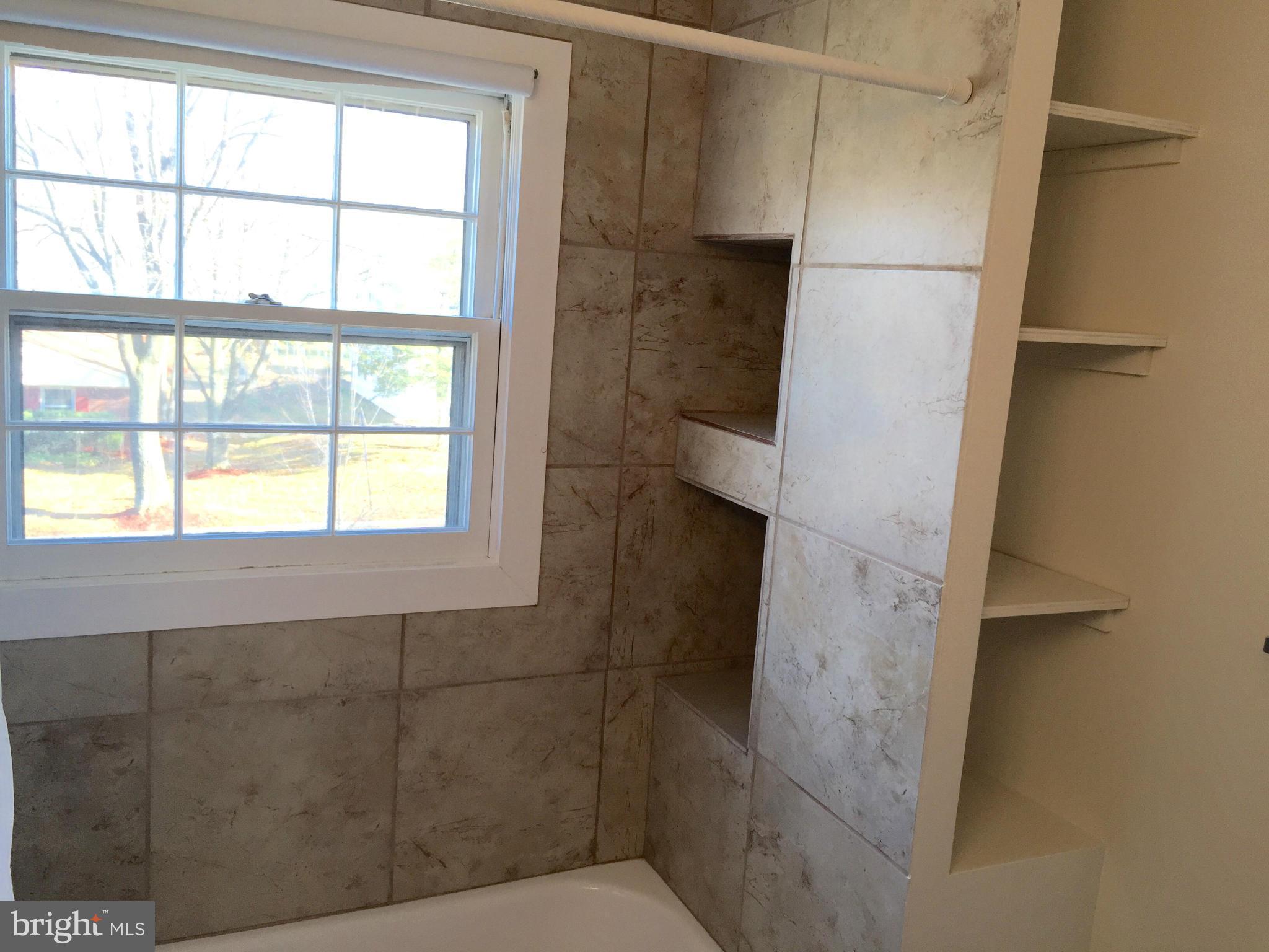 12612 Cedarbrook Lane Laurel, MD 20708 - Photo 17 of 22 a bathroom with a window