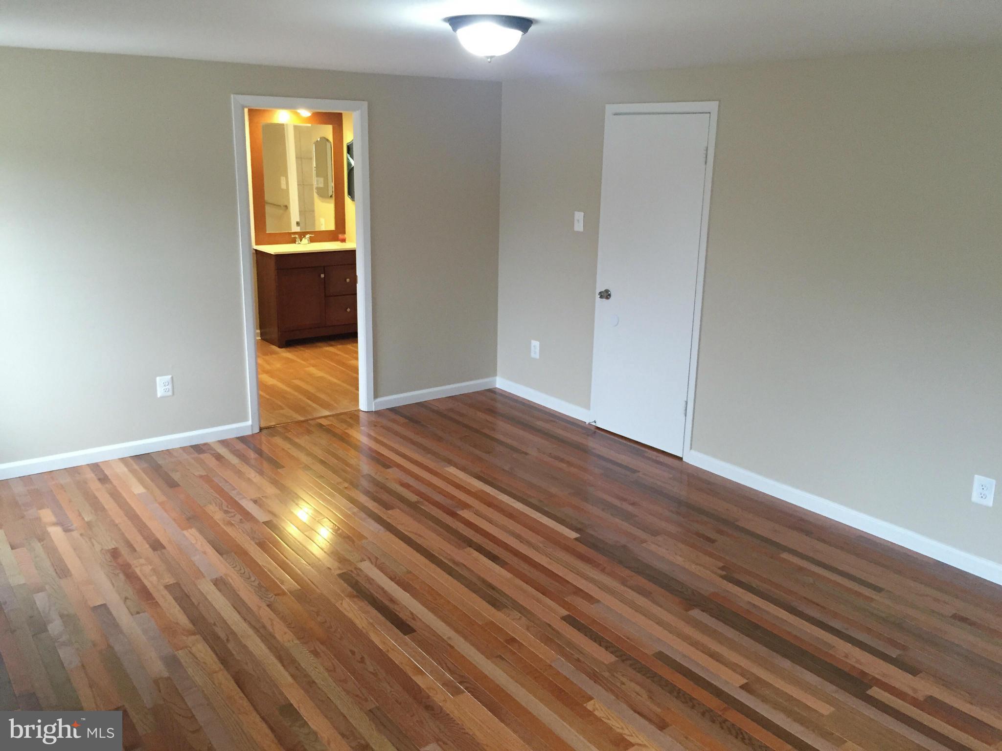 12612 Cedarbrook Lane Laurel, MD 20708 - Photo 6 of 22 wooden floor in an empty room