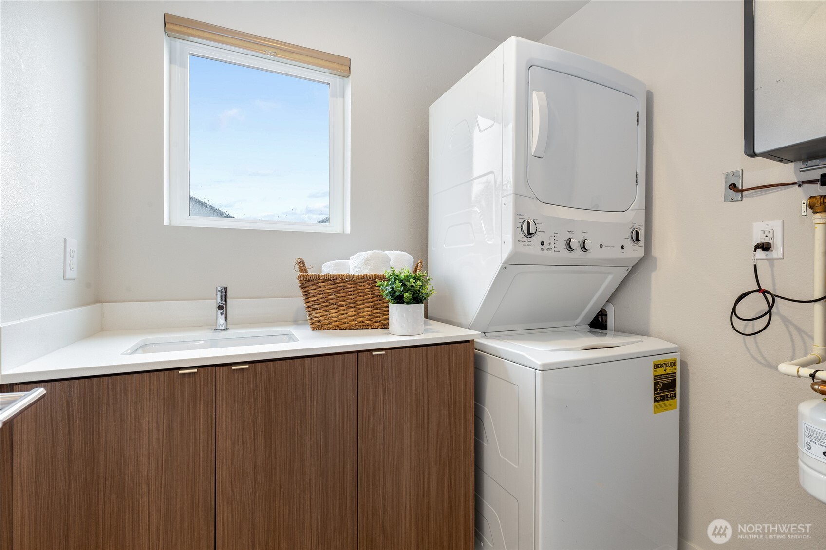 4272 Southwest Bradford Street Seattle, WA 98116 - Photo 25 of 28 a utility room with sink dryer and washer