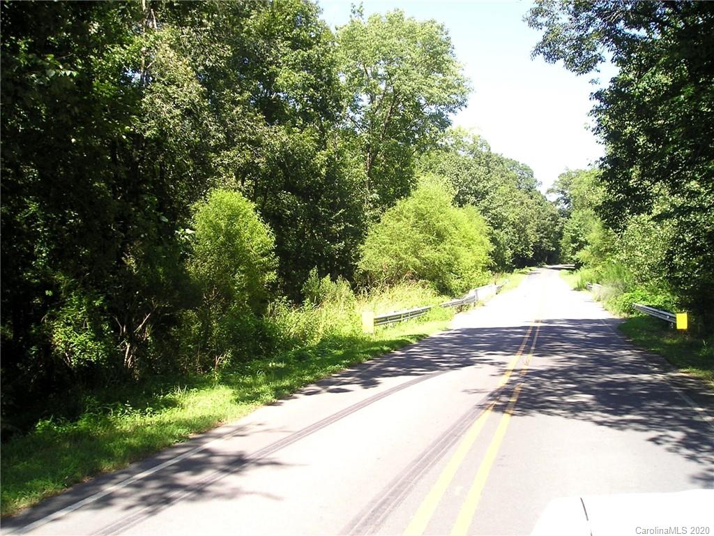 Tbd Stack Road Monroe, NC 28112 - Photo 2 of 10 a view of a street with a yard and large trees